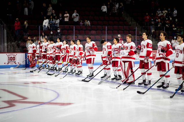 Boston University Terriers mens ice hockey team lines up at center ice while the national anthem plays at Agganis Arena.