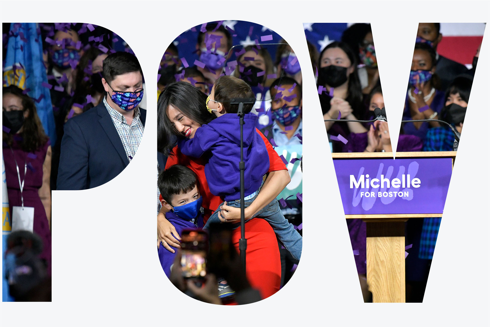 Michelle Wu stands on stage next to a podium reading "Michelle For Boston", with her family after being elected Mayor of Boston