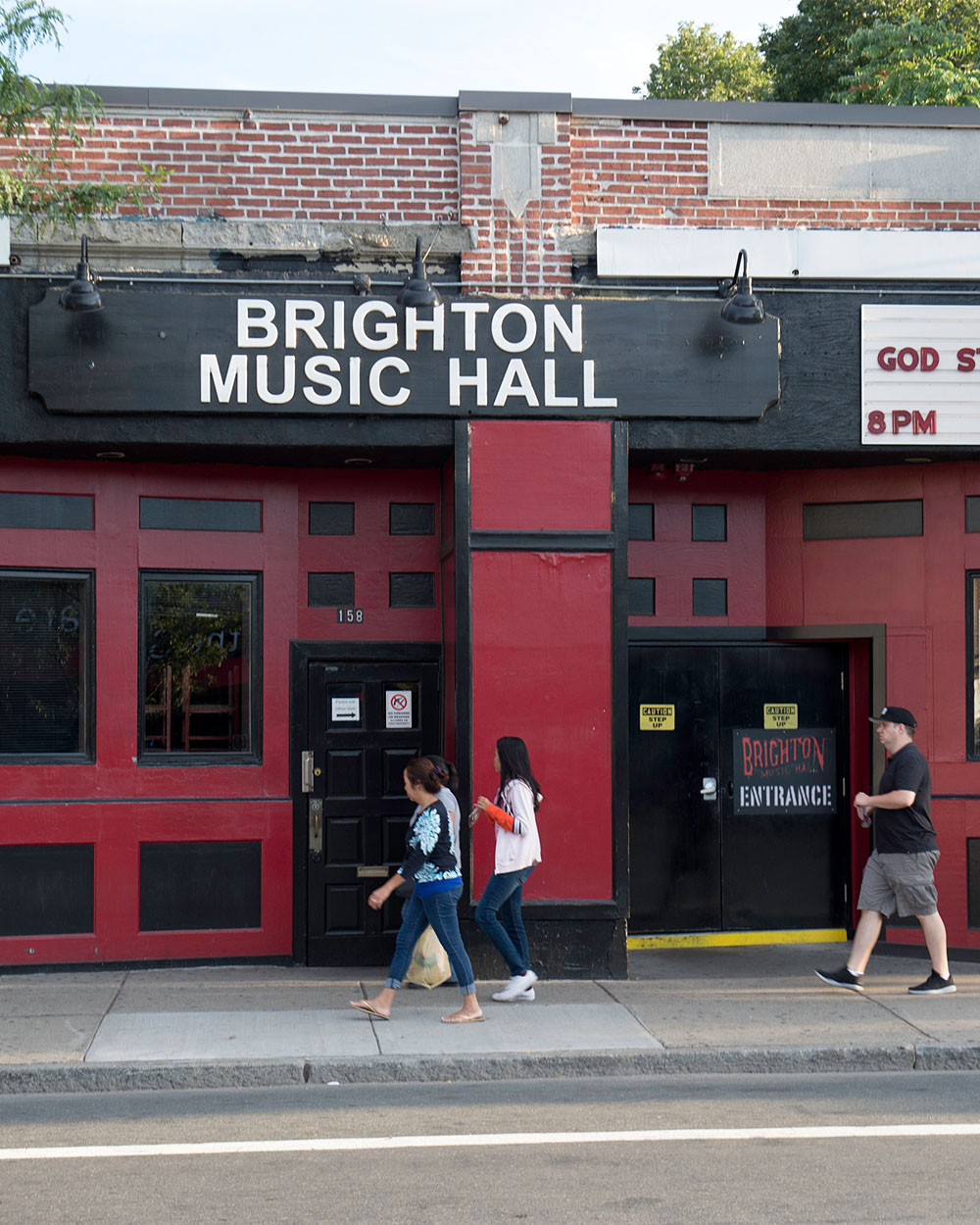 The front marquee of Brighton Music Hall in Brighton, MA on a cloudy day