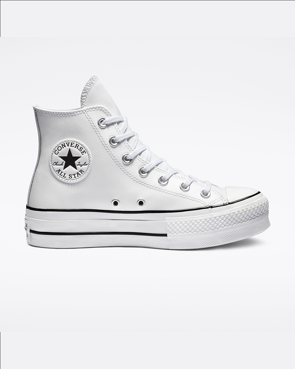 A white converse hightop sneaker on a white background