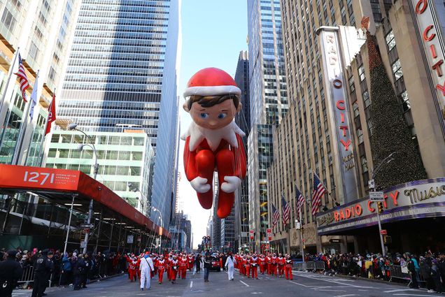 photo of the Elf on the Shelf balloon being led down Sixth Avenue just in time for the holiday season during the 91st Macys Thanksgiving Day Parade in New York.