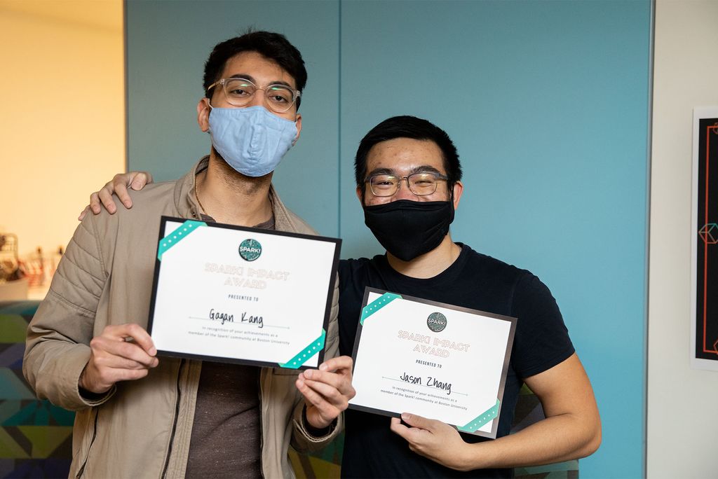 At BU Spark! Fall 2021 Demo Day, Gagan Kang (CAS’22) (left) and Jason Zhang (CAS’22) took home the Audience Choice Award for X-Lab Projects for their app, EvolvU, which connects people with business, life, and wellness coaches. Missing from the photo: Bernard Mulaw (CAS’22).