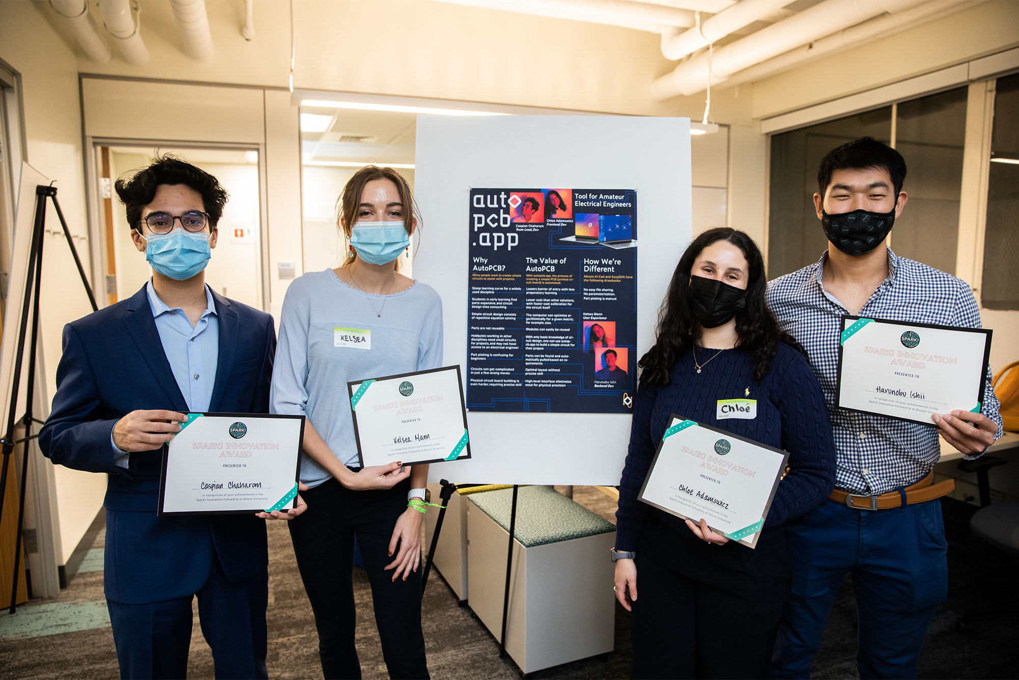 Caspian Chaharom (CAS’23) (left), Kelsea Mann (CFA’23), Chloe Adamowicz (CAS’22), and Harunobu Ishii (MET’22) pose for a photo after their autopcb app, which makes circuit design easily accessible, was awarded the Judges’ Choice Award for Innovation Fellows at the BU Spark! Fall 2021 Demo Day, December 10, 2021.