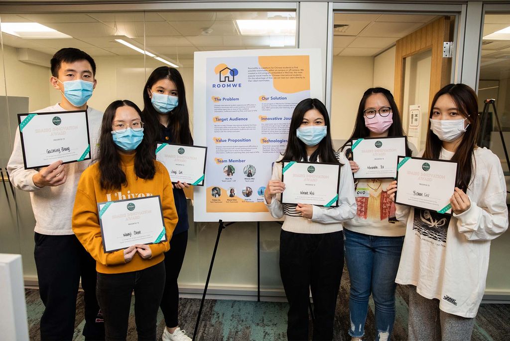 Winners of the Audience Choice Award for Innovation Fellows pose during the BU Spark! Fall 2021 Demo Day, December 10. From left: Gaoning Zhang (CAS’22), Wanyi Chen (CAS’22), Jacqueline Lin (CAS’23), Winnie Mei (CAS’22), Duo Xu (CAS’22), and Yichen Liu (CAS’23). The team won for their app, RoomWe, which matches Chinese students living on and off campus with prospective roommates.