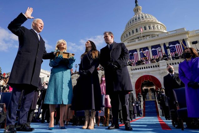 Photo of Joe Biden being sworn in as the 46th president of the United States by Chief Justice John Roberts as Jill Biden holds the Bible, during his Inauguration at the U.S. Capitol in Washington, Jan. 20, 2021, as their children Ashley and Hunter watch.
