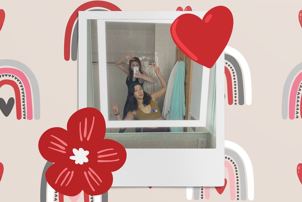 Image: Polaroid style mirror photo of 2 women making silly poses in their bathroom mirror . Polaroid is placed on a tan background with a pattern of neutral style rainbows, a red flower, and a red heart