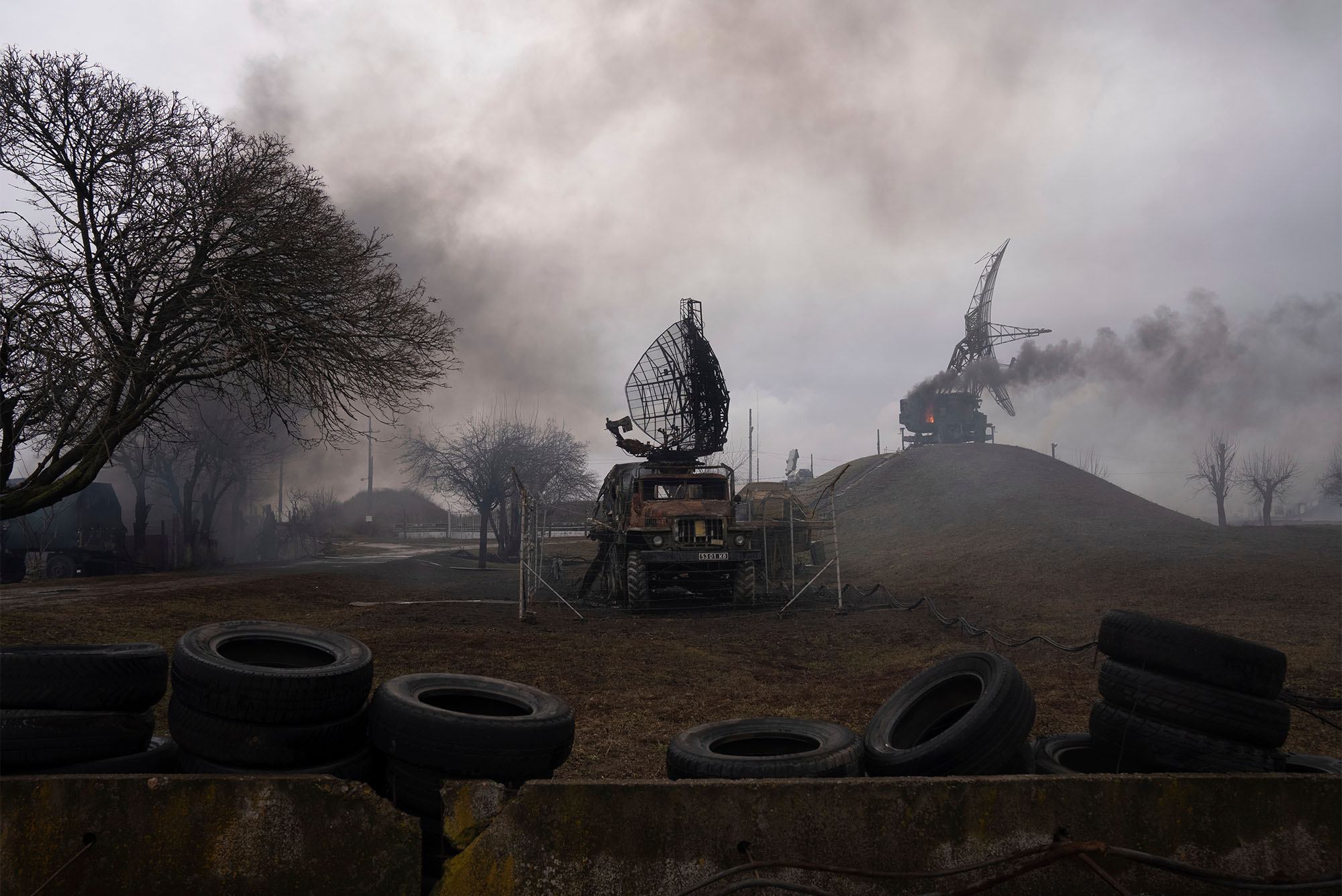 Smoke enveloped a Ukrainian air base in Mariupol after a Russian strike Thursday, part of Vladimir Putin’ invasion of his neighbor. Photo by AP/Evgeniy Maloletka