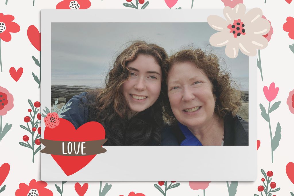 Image: Polaroid style selfie photo of a white mother and daughter at a seaside. Polaroid is placed on a tan background with a pattern of red, tan, and pink flowers, red hearts, and a large red heart with a brown banner with the word "love" on it in white