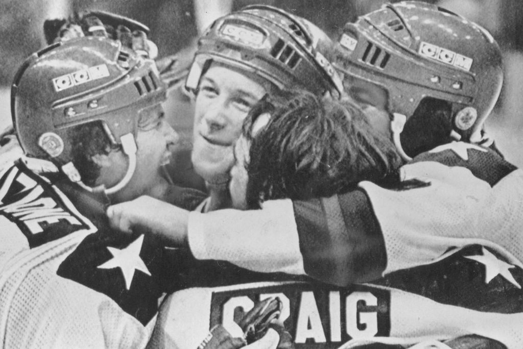 Jim Craig (Wheelock’80, MET’09) (front), Mike Eruzione (Wheelock’77) (left), Jack O’Callahan (CAS’79) (back) and Dave Silk (CAS’89, MET’92, Questrom’94) (right), the four former Terriers who played on Team USA’s 1980 “Miracle on Ice” squad that won the Olympic gold medal against all odds.