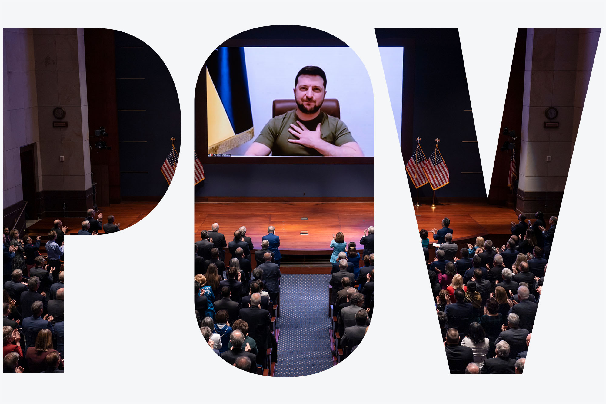 Photo of Ukrainian President Volodymyr Zelenskyy speaking to the U.S. Congress by video to plead for support. A Ukrainian man speaks on a large screen as people sit in auditorium seats to watch. Image is seen through white overlay letters "POV"