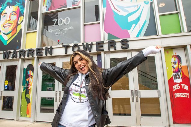 Allyson Imbacuan (CAS '23) gives a thorough tour of Warren Towers and shows what the large residence has to offer. Here she wears a leather jacket in front of Warren Towers in Boston MA. Photo by Cydney Scott for Boston University Photography.