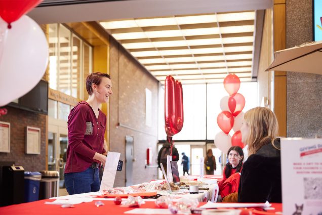 Bright balloons and tables stocked with BU swag heralded the return of Giving Day to campus April 6, the first such in-person event since 2019. Photo by Dana J. Quigley