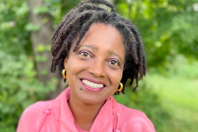 A portrait headshot of Tracy K. Smith outside on a sunny day