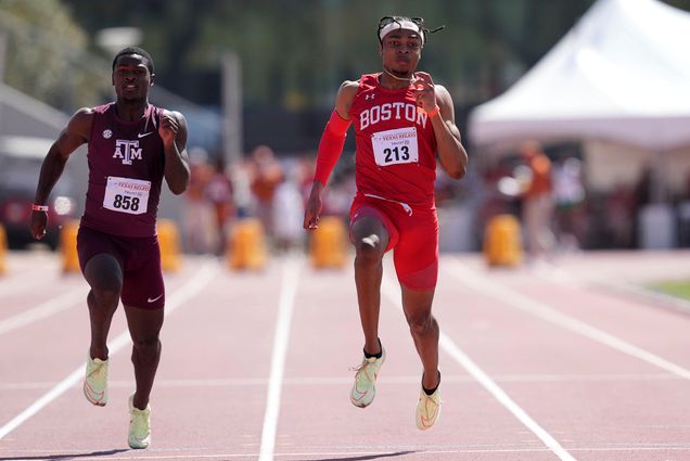 Photo of Toby Makoyawo (right) mid-stride next to Devon Achane of Texas A&M also mid-stride. Both are running towards the camera down the straightaway of the track. The starting blocks can be seen in the blurry background.