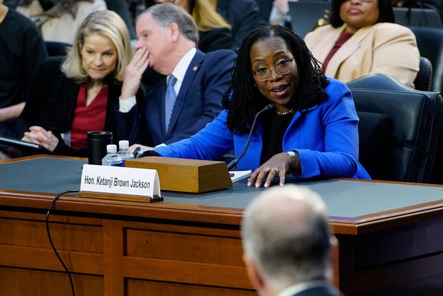 Supreme Court nominee Judge Ketanji Brown Jackson responds to a question from Sen. Thom Tillis, R-N.C., foreground, as she testifies before the Senate Judiciary Committee on Capitol Hill in Washington, Wednesday, March 23, 2022, during her confirmation hearing. (AP Photo/Susan Walsh)