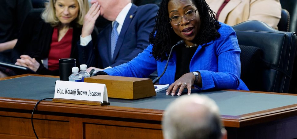 Supreme Court nominee Judge Ketanji Brown Jackson responds to a question from Sen. Thom Tillis, R-N.C., foreground, as she testifies before the Senate Judiciary Committee on Capitol Hill in Washington, Wednesday, March 23, 2022, during her confirmation hearing. (AP Photo/Susan Walsh)