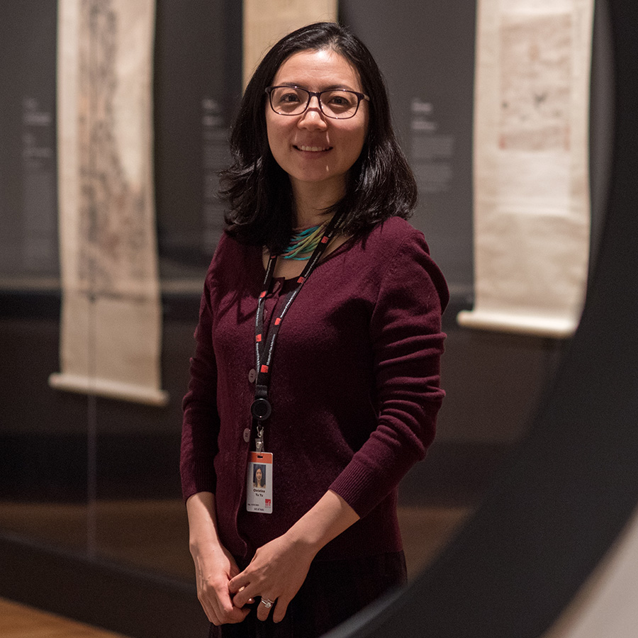 Profile photo of Christina Yu Yu (GRS'04), Matsutaro Shoriki Chair, Art of Asia, MFA. She stands and faces the camera at a tilted angles wearing a burgundy sweater with her sleeves rolled up.