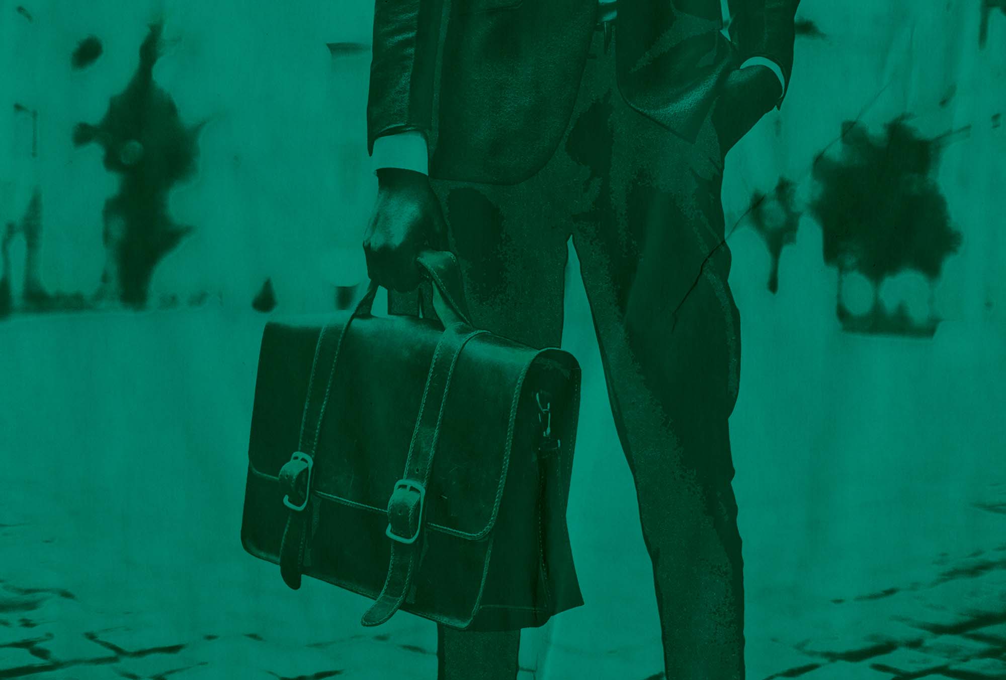 Photo of a person in a fancy suit holding a brief case in their right hand. They are seen standing on a street sidewalk. Their other hand is in their pocket. Image has a blue-teal overlay and effects added that make the image look as if it were printed poorly.