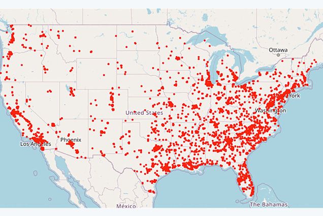 Image of a map of the lower 48 states of the United States in tan. Overlaid are a serious of red dots indicating the number of gun violence deaths in 2022 so far. The dots are concentrated around the coasts, but no state is without dots.