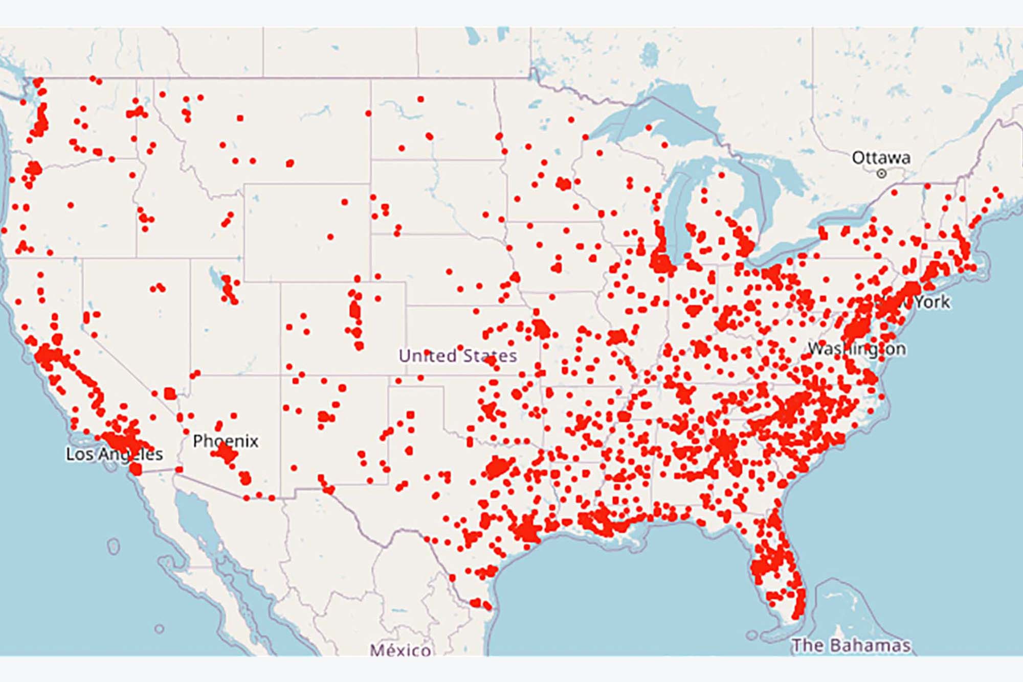 Image of a map of the lower 48 states of the United States in tan. Overlaid are a serious of red dots indicating the number of gun violence deaths in 2022 so far. The dots are concentrated around the coasts, but no state is without dots.