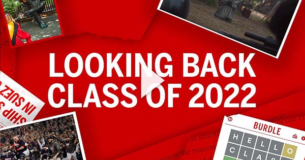 Red collage illustration that reads "Looking Back, Class of 2022" at center in uppercase, white font. Around the edges of the image are photos and screenshots from memorable moments from the past four years, including the red sox winning the world series, students posing with the Rhett bench, baby Yoda, and a screenshot of BURDLE, a play on the popular game Wordle. White video play button is overlaid.