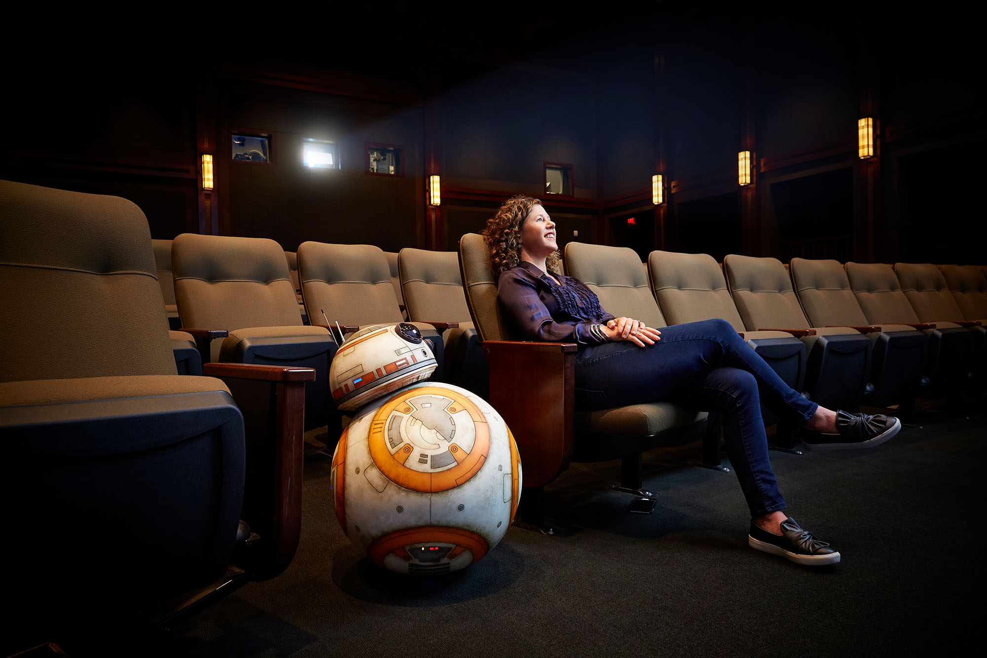 Janet Lewin helps filmmakers develop the special effects technology needed to bring characters—like the Star Wars droid BB-8—to life on screen. Here Lewin and BB-8 sit in a cinema