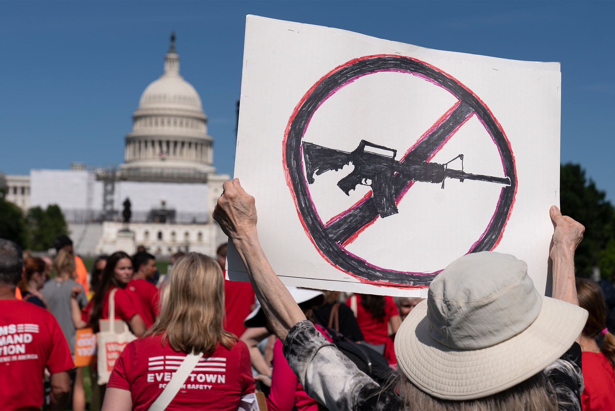 Jane Harman, from Takoma Park, Md., holds a sign during a Students Demand Action event, near the West Front of the U.S. Capitol, Monday, June 6, 2022, in Washington. The group demanded action on gun safety in the wake of the mass shooting at Robb Elementary School in Uvalde, Texas. (AP Photo/Alex Brandon)