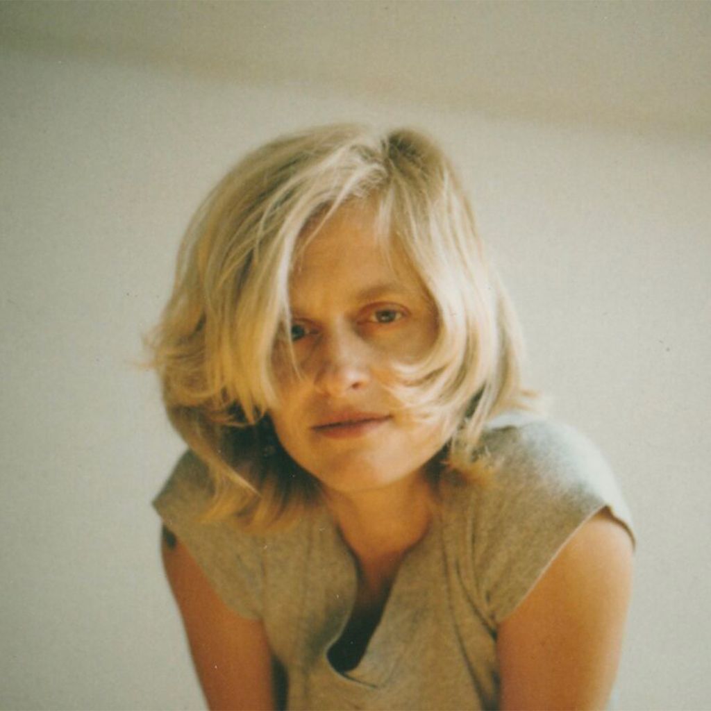 A photo of Karen Harris, a white woman with blonde hair in a grey t shirt