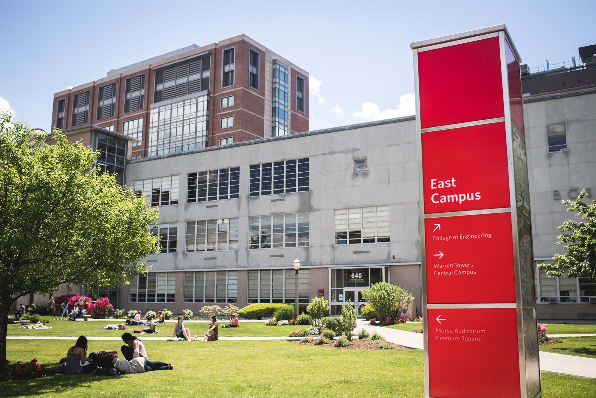 Students relax on the COM Lawn at Boston University on a sunny day