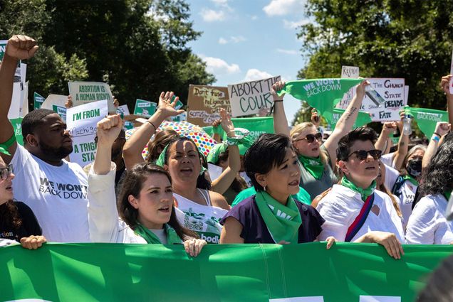 Demonstrators with Center for Popular Democracy and other organizations perform a mass civil disobedience in support of abortion access by sitting and blocking an intersection near the Supreme Court in Washington, D.C. on June 30, 2022. (Photo by Bryan Olin Dozier/NurPhoto via AP)