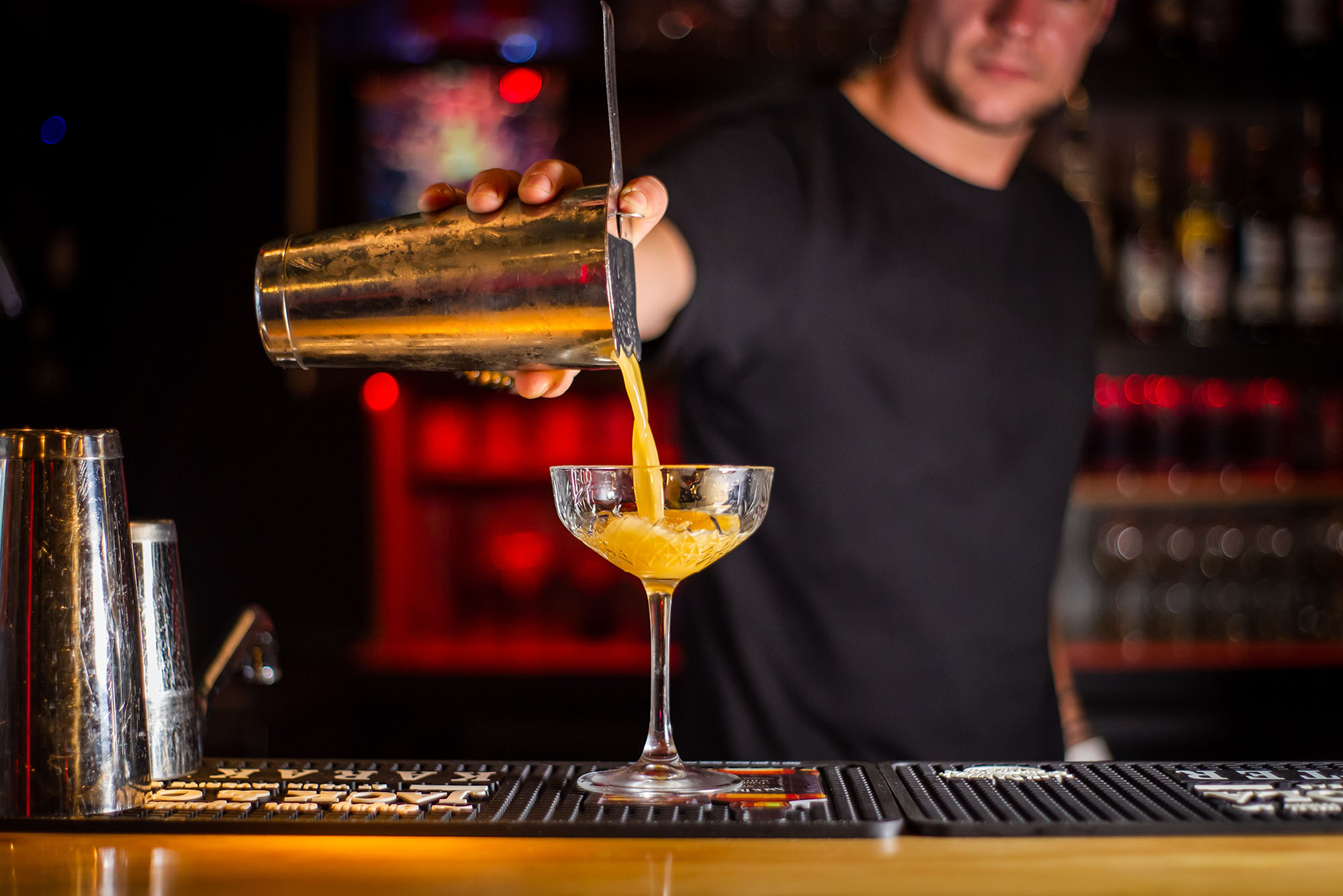 research paper on drinking age A bartender pours a cocktail out of a shaker and into a high glass
