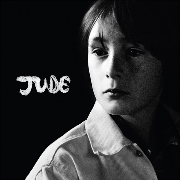 Album cover shows a black and white photo of a young boy in a stark black room. White title reads "JUDE"