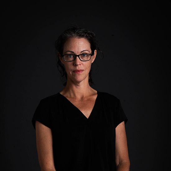 photo of SPH professor, Madeleine Scammell. She stands in front of a black backdrop with hands clasped in front of her.