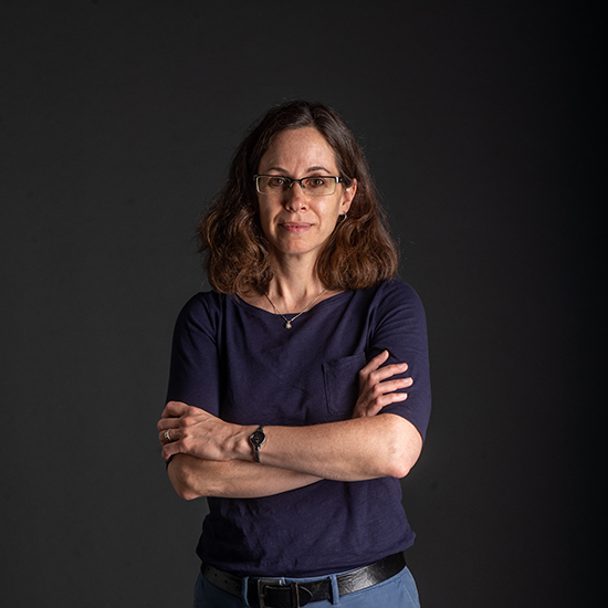 photo of Professor Pamela Templer for The Brink. She stands in front of black backdrop with arms crossed wearing a dark blue top and jeans.