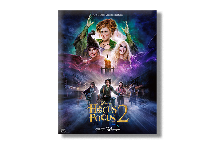 Movie Poster for the Hocus Pocus 2 movie. Poster features headshots of the three main witches and the teen protagonists below them in a purple and black theme. Gold words below all of them read "Hocus Pocus 2"
