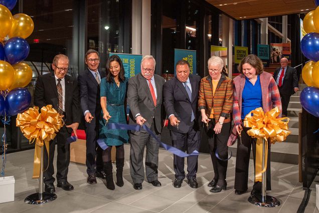 Photo: The Ribbon cutting to officially open the Center for Computing and Data Science Dec 8. From left are Associate Provost for Computing and Data Sciences Azer Bestavros, CAS dean Stan Sclaroff, Boston City Mayor Michelle Wu, President Robert A Brown, Board of Trustees chair Ahmass Fakahany (Questrom’79), Provost Jean Morisson, and Boston city councilor Kenzie Bok. They all stand with scissors in hand looking down as a cut blue ribbon floats to the ground.