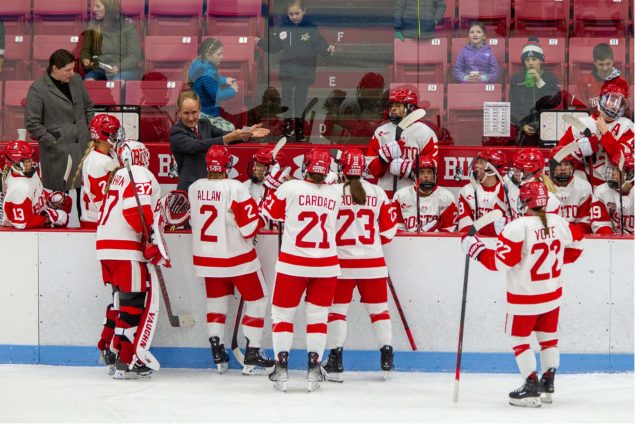 BU women’s hockey players and head coach Brian Durocher during their 3-2 overtime victory over Holy Cross on December 9. The Terriers will face the Crusaders at Fenway Park on January 6. Photo by Iman Zarrinkoub (SDM’25)