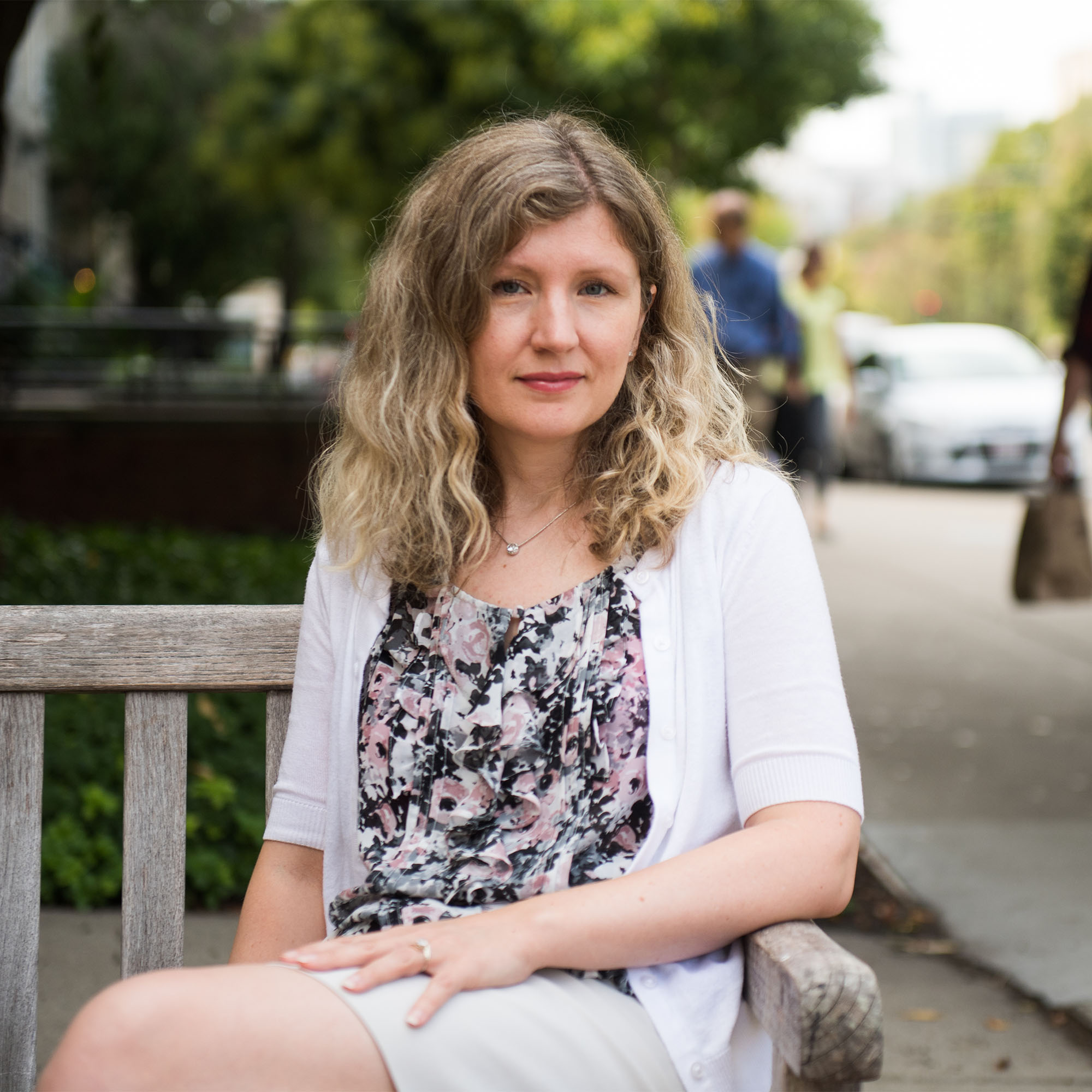 Kate Saenko sitting on a bench on BU Campus in Boston, MA