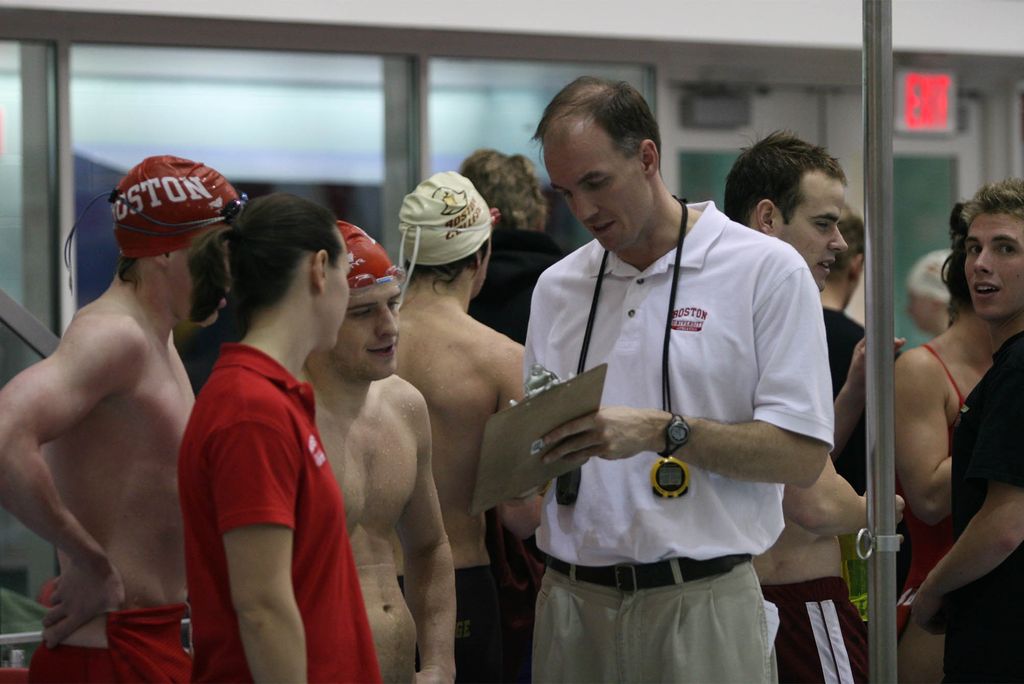 Bill Smyth and team members from BU Swim and Dive in 2005, his first season with the Terriers. “I consider myself fortunate and blessed to have made relationships with the team and alumni from across the decades,” Smyth said in announcing his retirement.