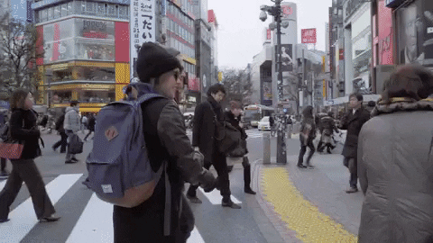 GIF: Two people exploring a foreign city.