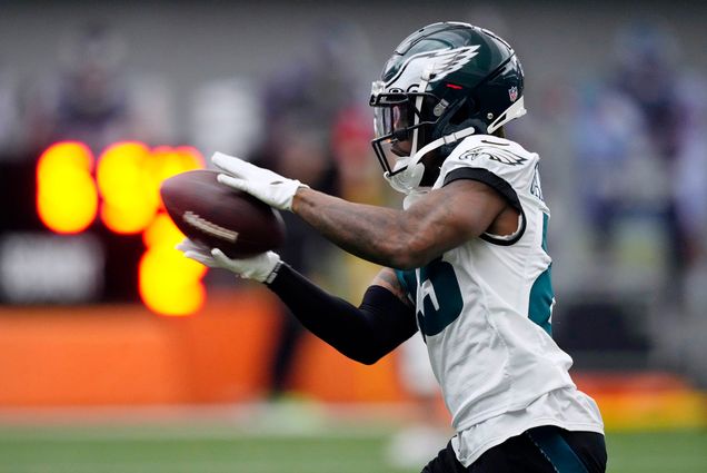 Photo: Philadelphia Eagles' C.J. Gardner-Johnson catches a pass during practice at the NFL football team's training facility, Friday, Feb. 3, 2023, in Philadelphia. A Black man wearing a dark green and white Eagles' football uniform and helmet catches a football in his hands.