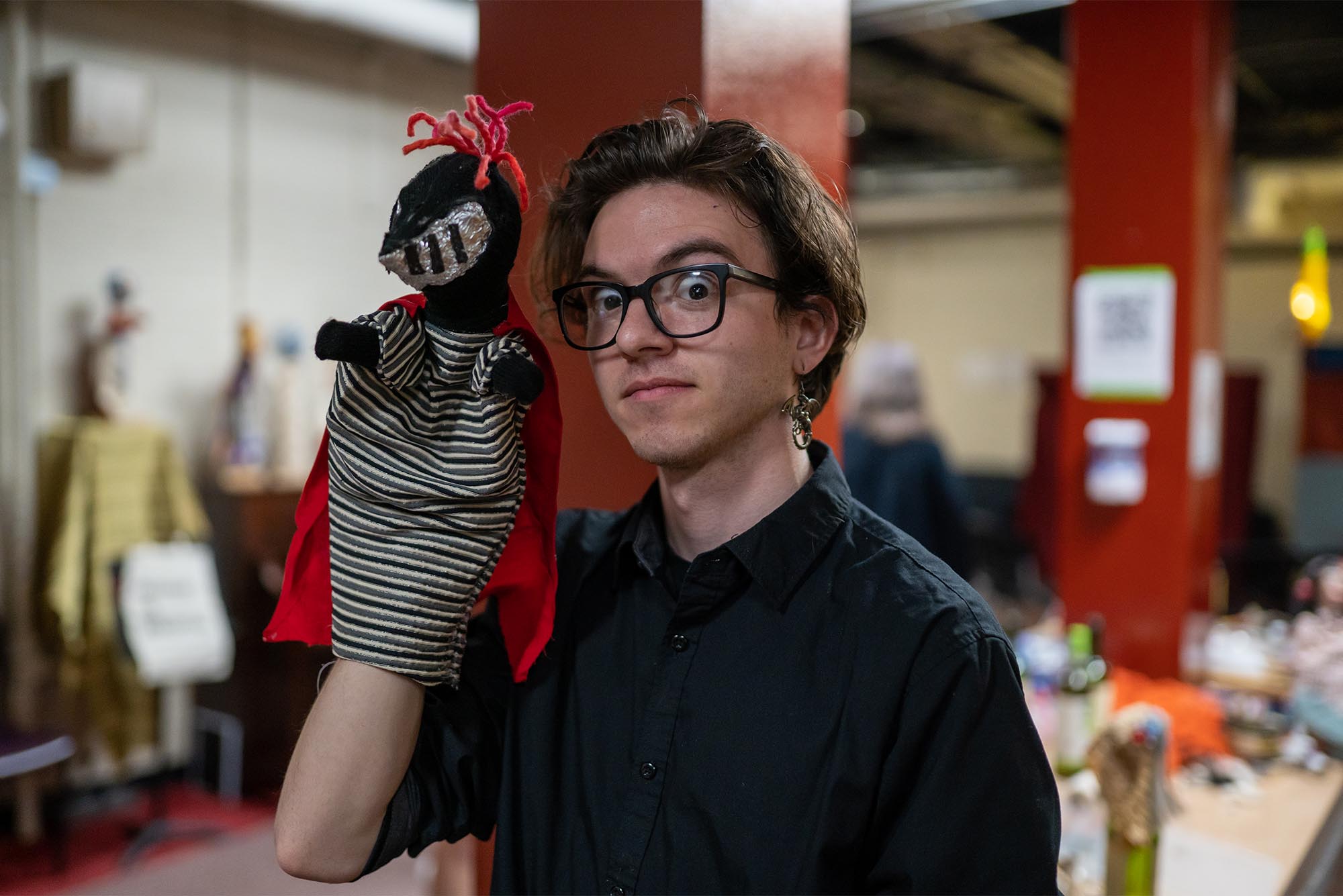 In honor of World Puppetry Day, Italian hand puppeteer Maurizio Gioco led a workshop for BU students on how to make a hand puppet followed by an impromptu puppet cabaret March 21. The event, held in the basement lounge at 520 Park Drive, was co-hosted by the College of Fine Arts and Residence Life. Gioco holds a puppet with a cape and a striped shirt.