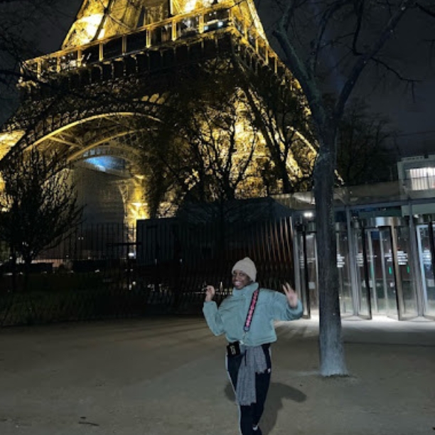 Photo: Jada Warmington (Questrom’23) standing in front of the Eiffel Tower