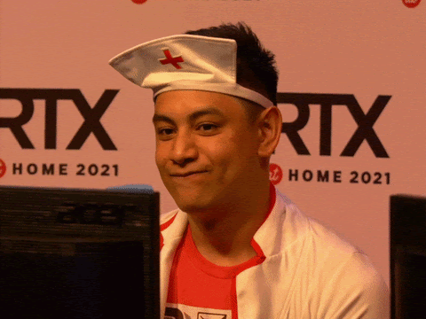 This is a gif of a man wearing a costume, and the camera zooms in on him. He is making a face of defeat, with lips in a straight formation, letting out a sigh.