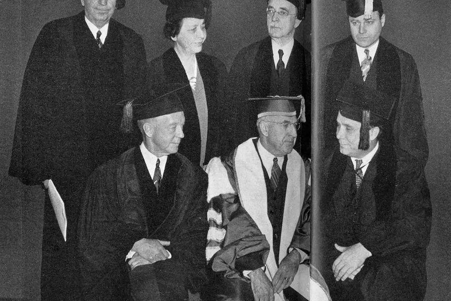 Photo: A black and white photo of notable faculty, including President Marsh. None were ready for the photo, instead looking off into the distance or to whomever was talking. Top, left to right: James Chamberlain Baker, Elizabeth Burchenal, Guy Wilbur Cox, Howard McGrath and seated from left: Frank Howard Lahey, President Marsh, and Wendell Lewis Willkie.