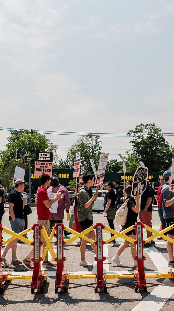 Photo: Protestors outside Harry Agganis Way support the Writers Strike admist the annoucement of David Zaslav as Commencement Speaker for BU's 150th Commencement.