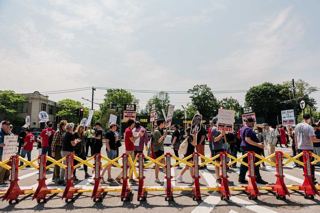 Photo: Protestors outside Harry Agganis Way support the Writers Strike admist the annoucement of David Zaslav as Commencement Speaker for BU's 150th Commencement.