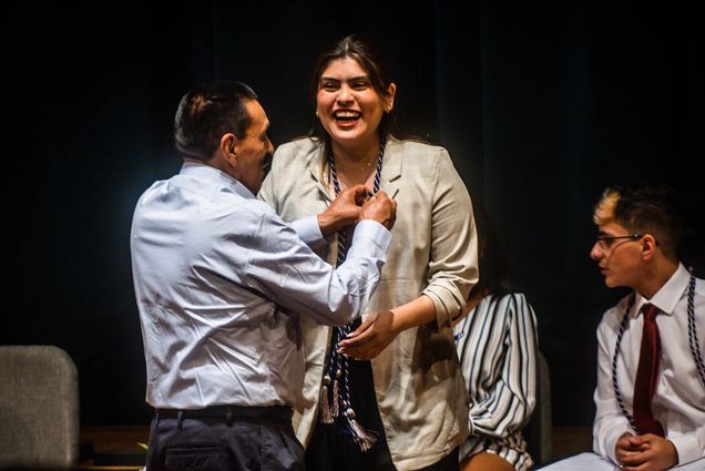 Photo: Allyson Imbacuan (CAS 23), wearing a light shirt with dark hair, laughs while receiving a pin during the Newbury Center First Generation Pinning Ceremony and Reception at the Tsai Auditorium on May 19, 2023. Photo by Jackie Ricciardi for Boston University