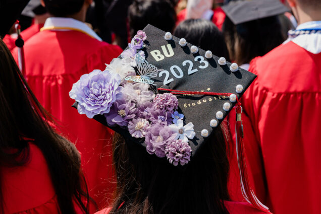 Photo: A decorated cap with purple flowers on the left side and bold letters that read "BU 2023".