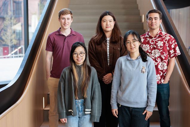 Photo: Students stand and pose for a photo at the bottom of a set of stairs. From right to left, top to bottom: Daniel Skahill (CDS ‘23), Samantha Chen (CDS ‘23), Zining Ye (CDS ‘23), Yile Wang (CDS ‘23), and Edward Wong (CDS ‘23).